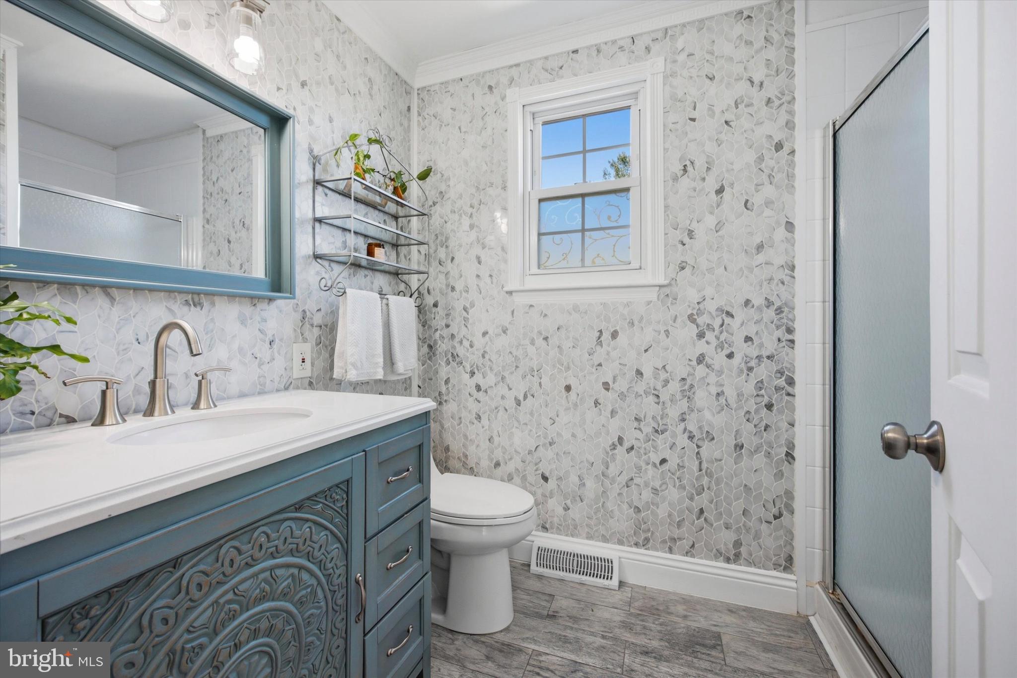 1 Country Village Way Media, PA 19063 - Photo 33 of 50 a bathroom with a granite countertop sink a toilet and shower