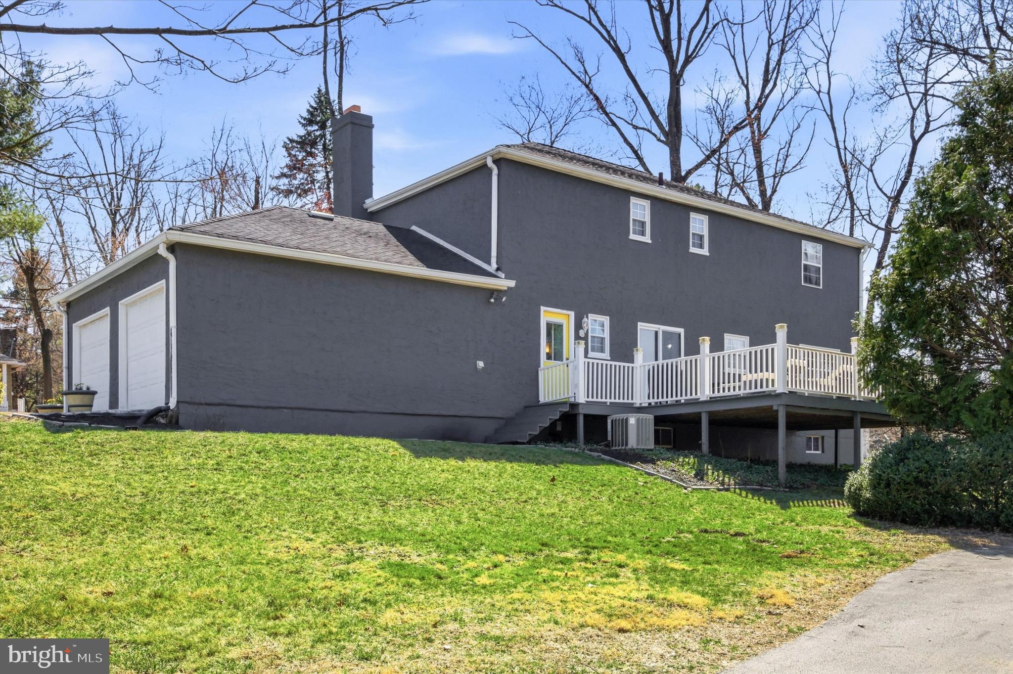 1 Country Village Way Media, PA 19063 - Photo 49 of 50 a front view of a house with a garden and yard