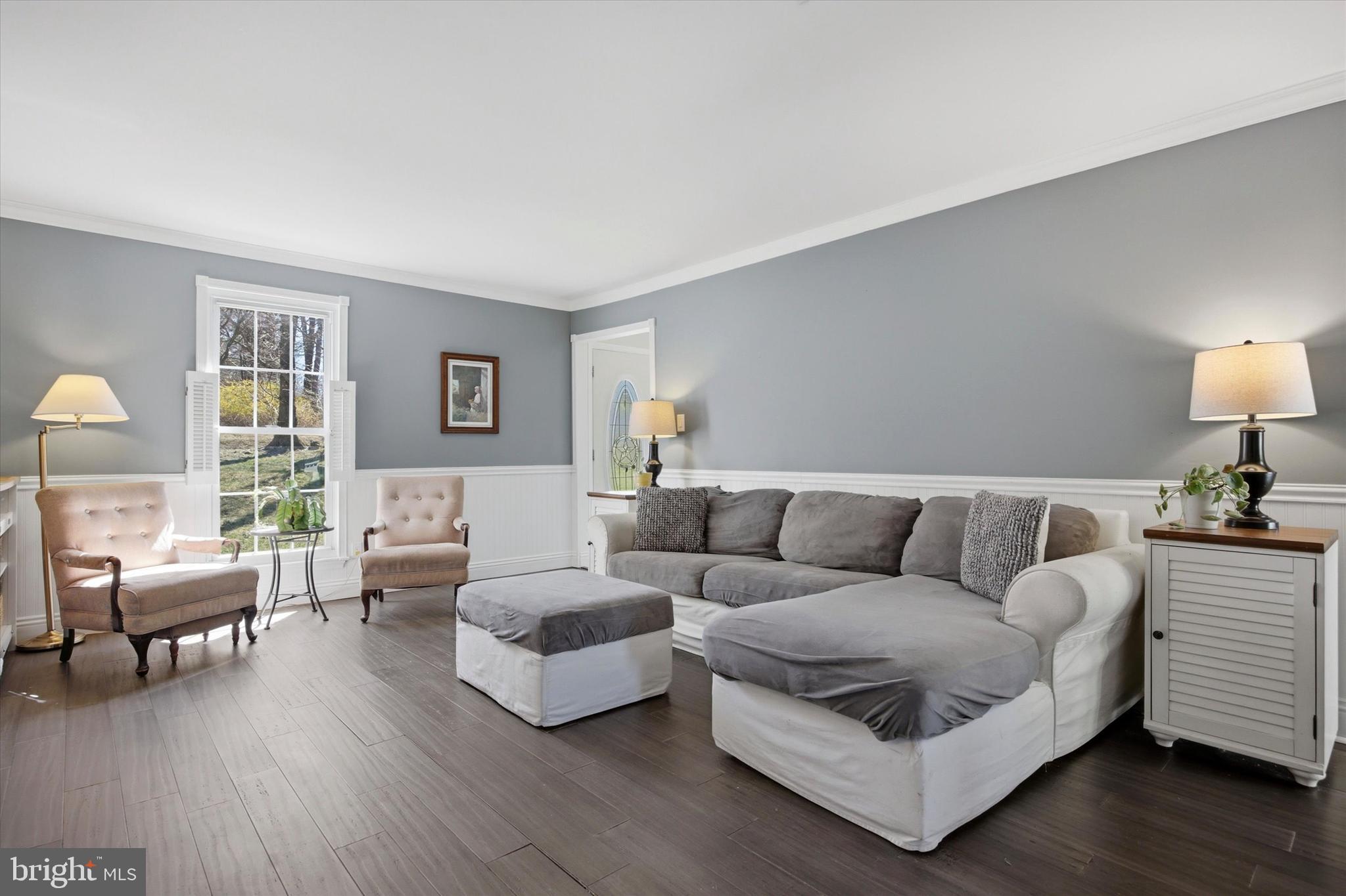 1 Country Village Way Media, PA 19063 - Photo 9 of 50 a living room with furniture and a wooden floor