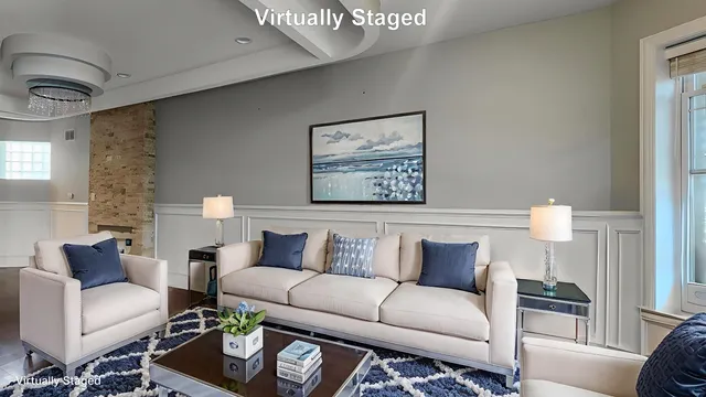 a living room with furniture and a painting on the wall