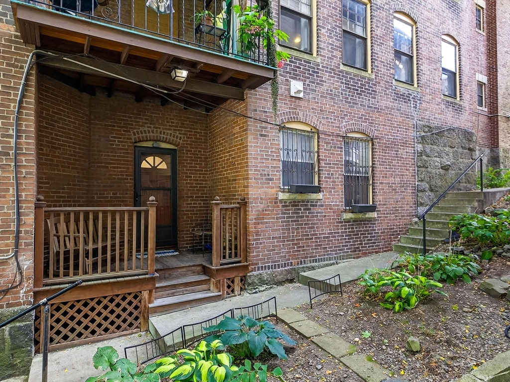 32 Robinwood Avenue, Unit 7 Boston, MA 02130 - Photo 22 of 24 a view of a house with a door and wooden floor