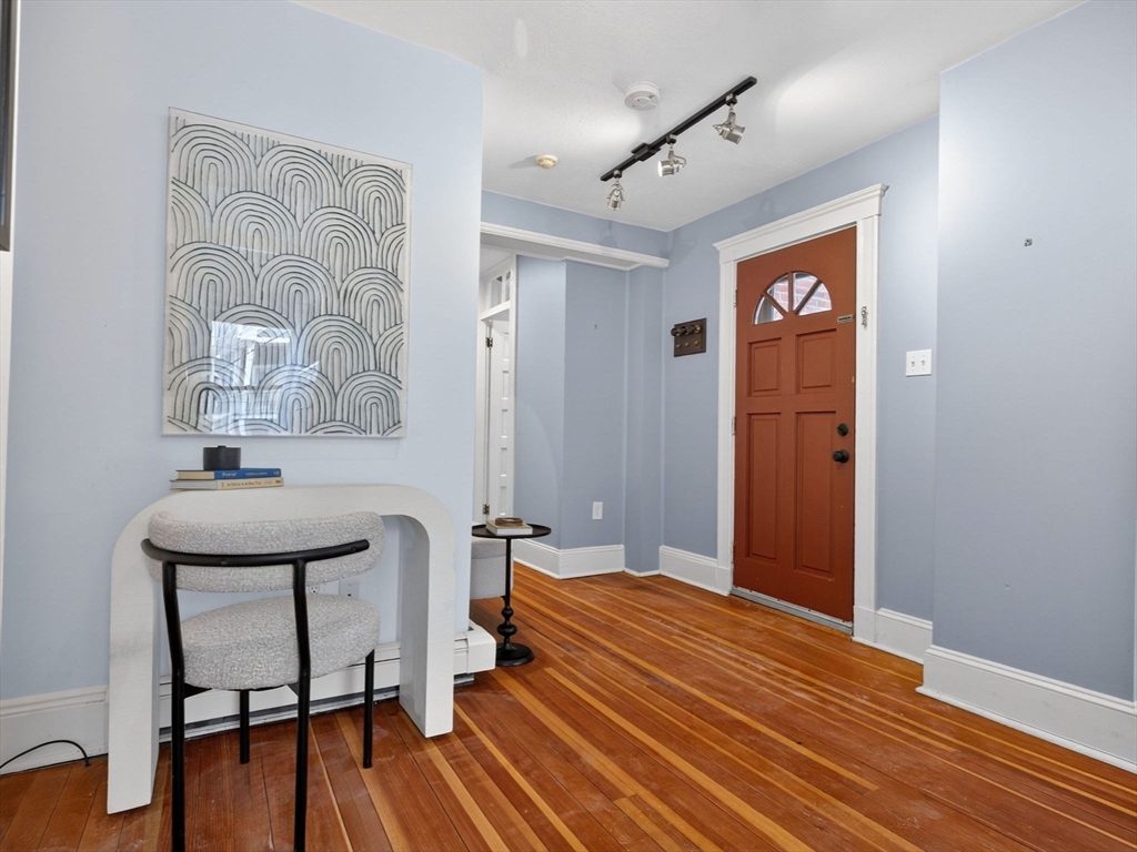 32 Robinwood Avenue, Unit 7 Boston, MA 02130 - Photo 6 of 24 a room with a table and chairs