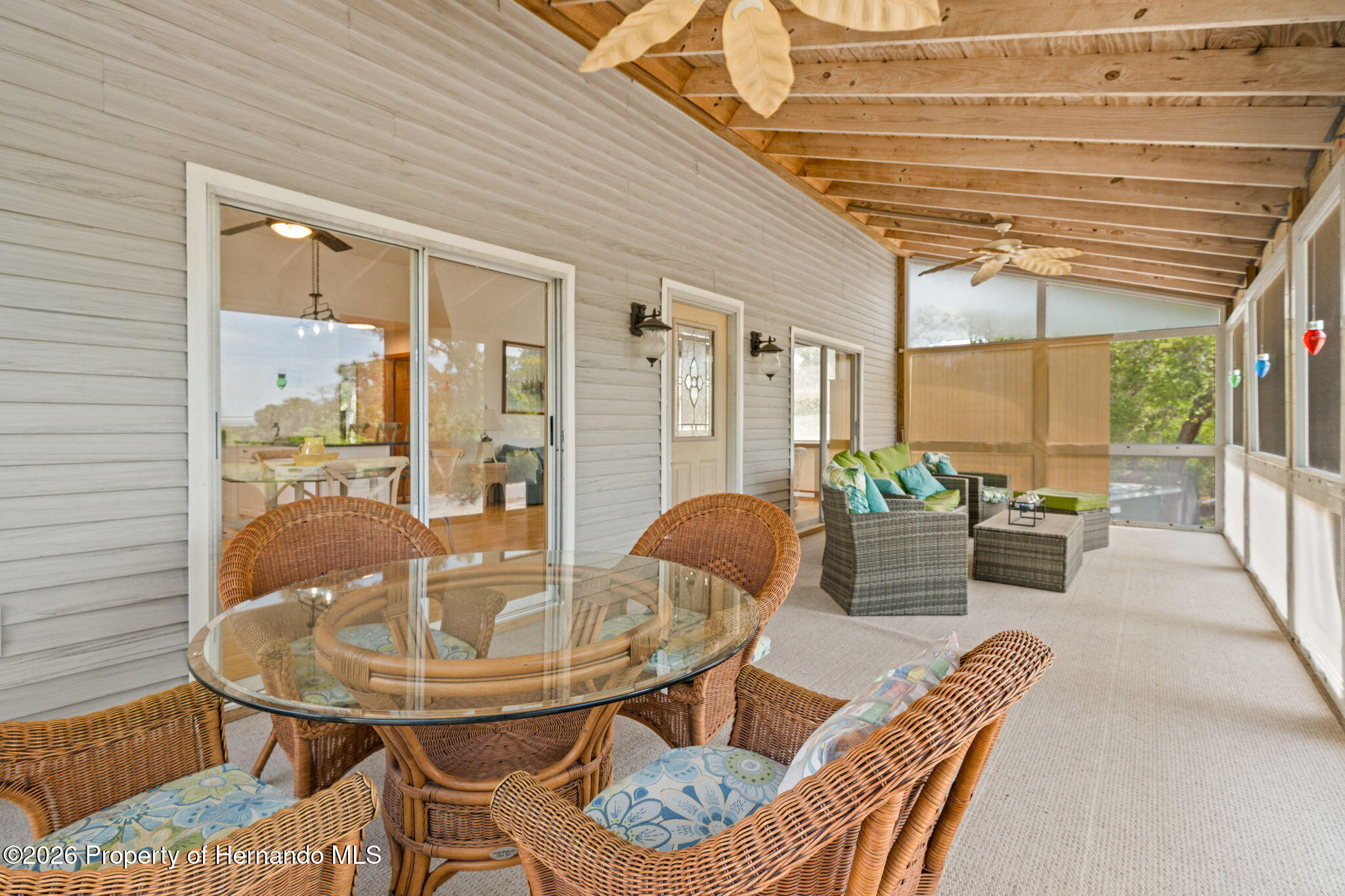 1566 Indian Bay Road Spring Hill, FL 34607 - Photo 14 of 56 a dining room with furniture and a table