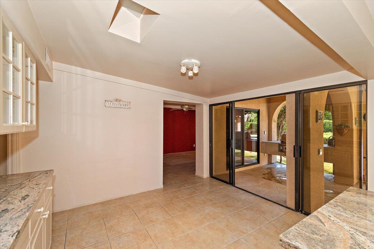 40885 Thunderbird Road Rancho Mirage, CA 92270 - Photo 21 of 61 a view of a big room with windows and entryway