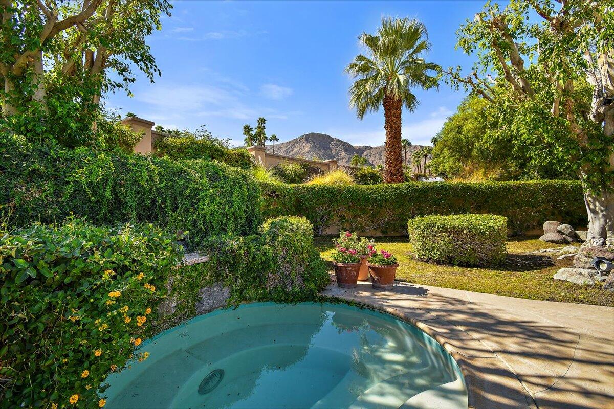 40885 Thunderbird Road Rancho Mirage, CA 92270 - Photo 24 of 61 a view of a lake with a yard