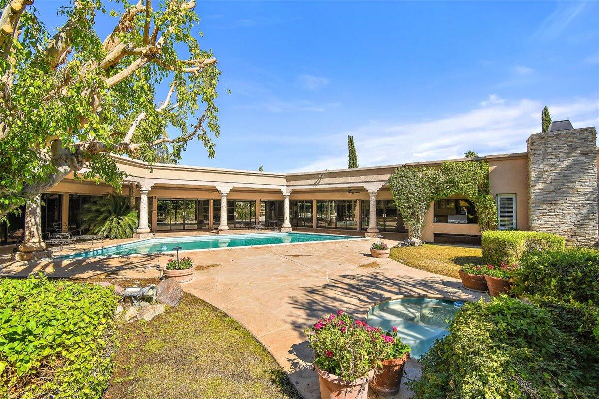 40885 Thunderbird Road Rancho Mirage, CA 92270 - Photo 25 of 61 a front view of a house with a yard