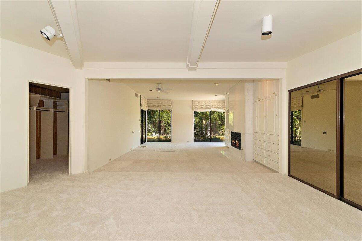 40885 Thunderbird Road Rancho Mirage, CA 92270 - Photo 27 of 61 a view of an empty room with a window