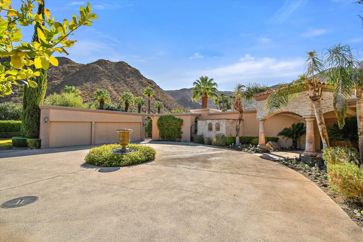 40885 Thunderbird Road Rancho Mirage, CA 92270 - Photo 4 of 61 a house with a yard and a outdoor space