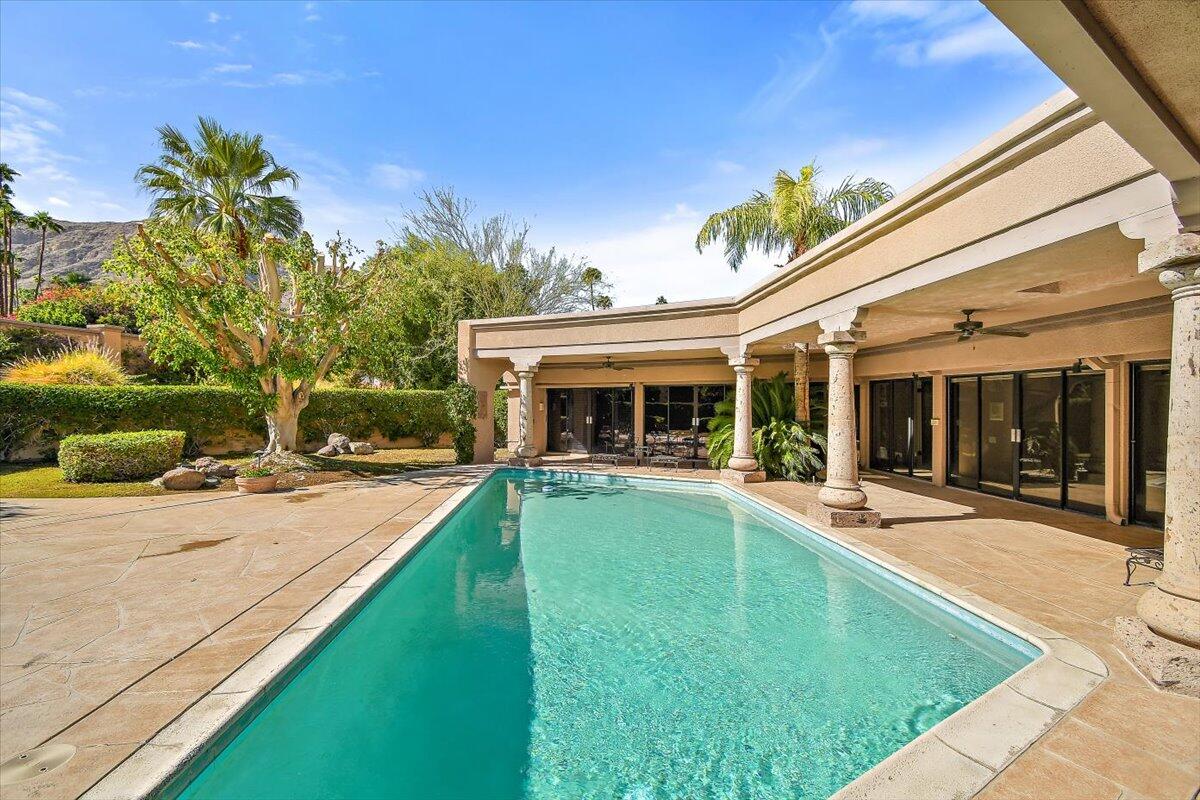 40885 Thunderbird Road Rancho Mirage, CA 92270 - Photo 43 of 61 a view of a house with swimming pool and a yard