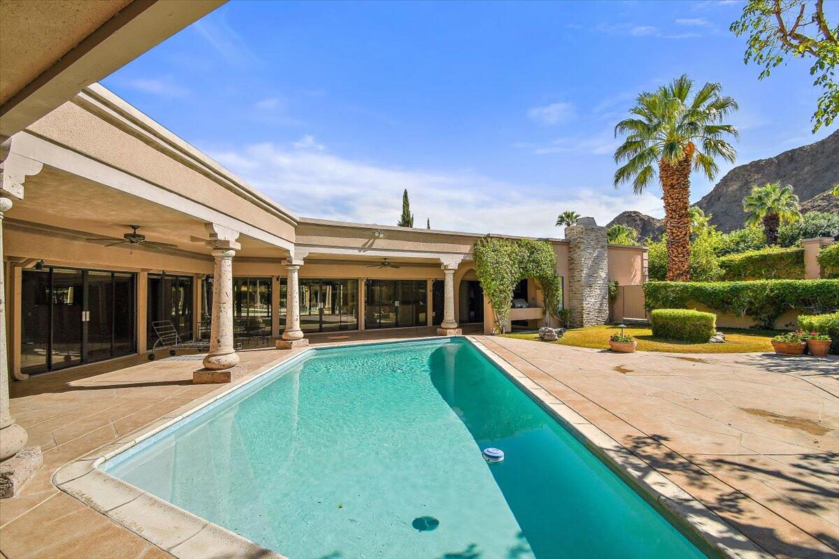 40885 Thunderbird Road Rancho Mirage, CA 92270 - Photo 44 of 61 a view of a house with swimming pool and sitting area