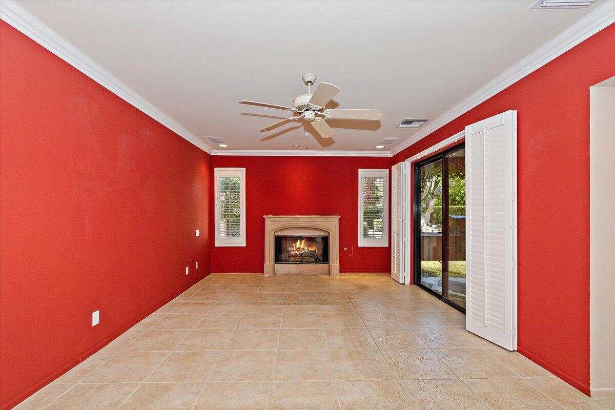 40885 Thunderbird Road Rancho Mirage, CA 92270 - Photo 51 of 61 a view of an empty room with a fireplace and a window