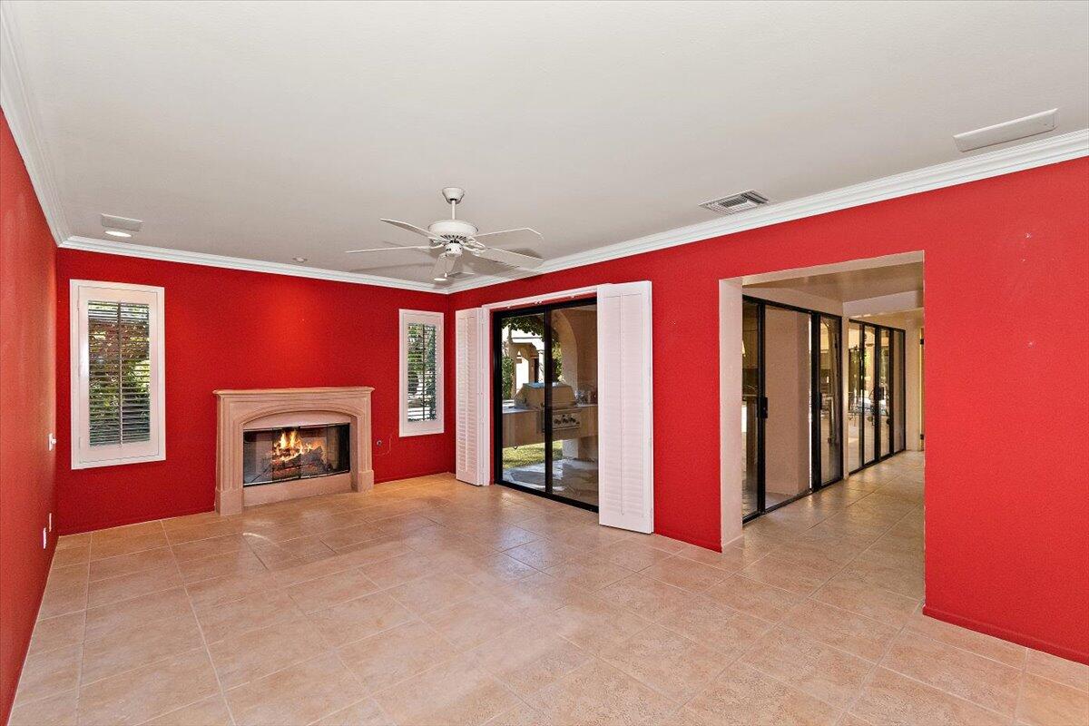 40885 Thunderbird Road Rancho Mirage, CA 92270 - Photo 52 of 61 a view of a livingroom with a fireplace and chandelier