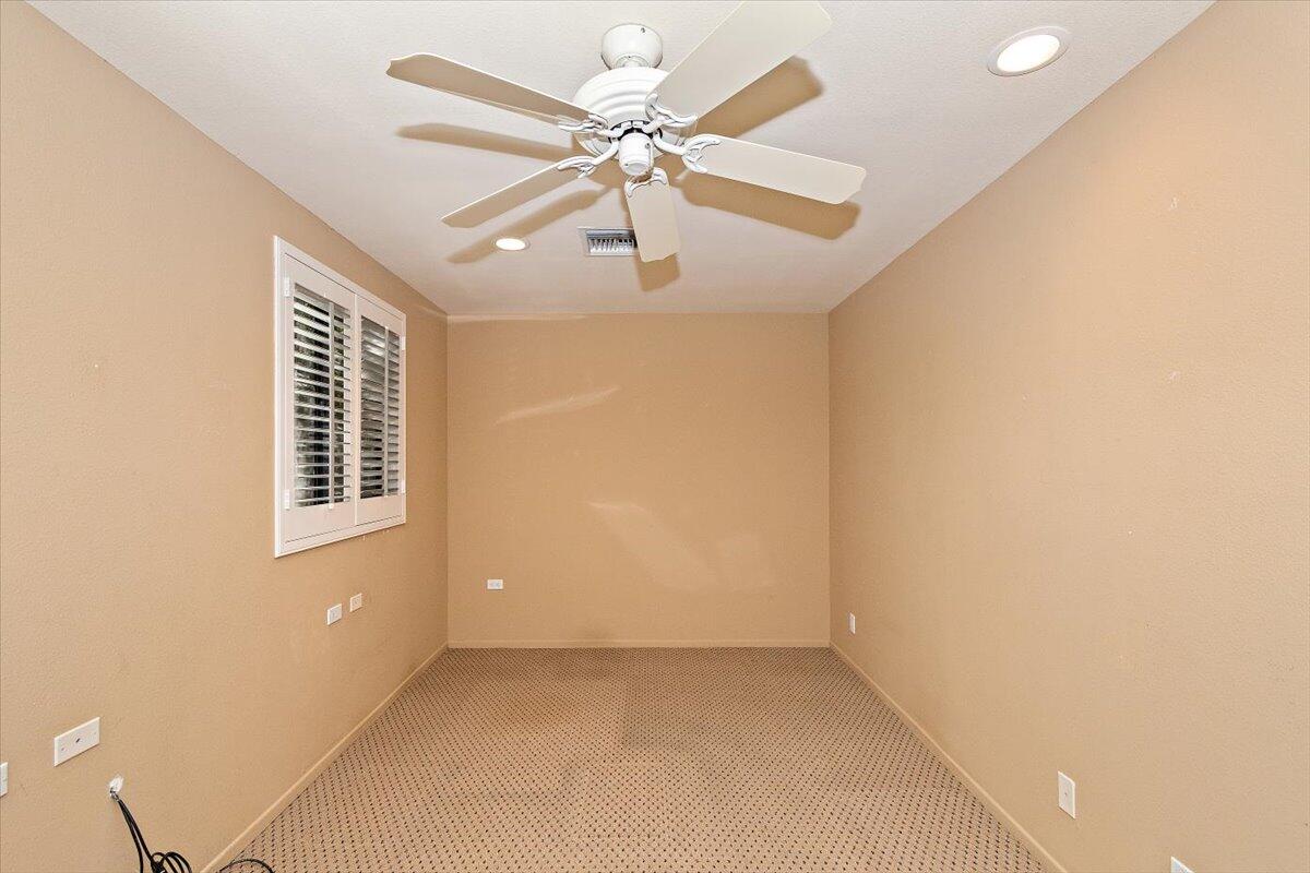 40885 Thunderbird Road Rancho Mirage, CA 92270 - Photo 53 of 61 an empty room with windows and fan