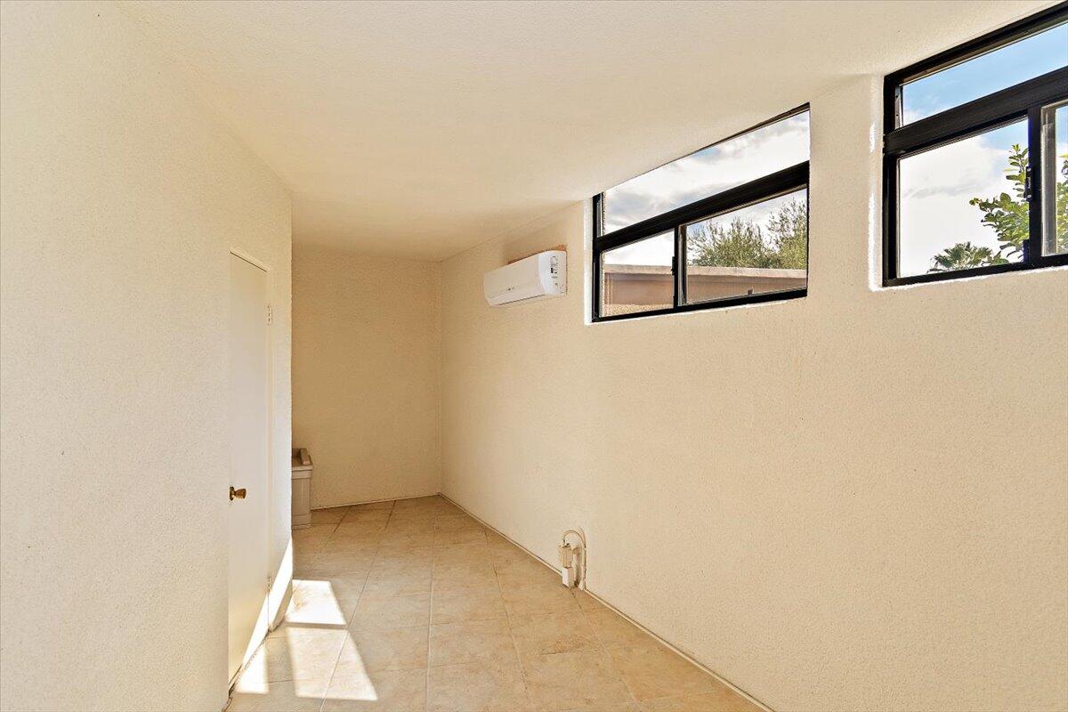 40885 Thunderbird Road Rancho Mirage, CA 92270 - Photo 57 of 61 a view of an empty room with a window