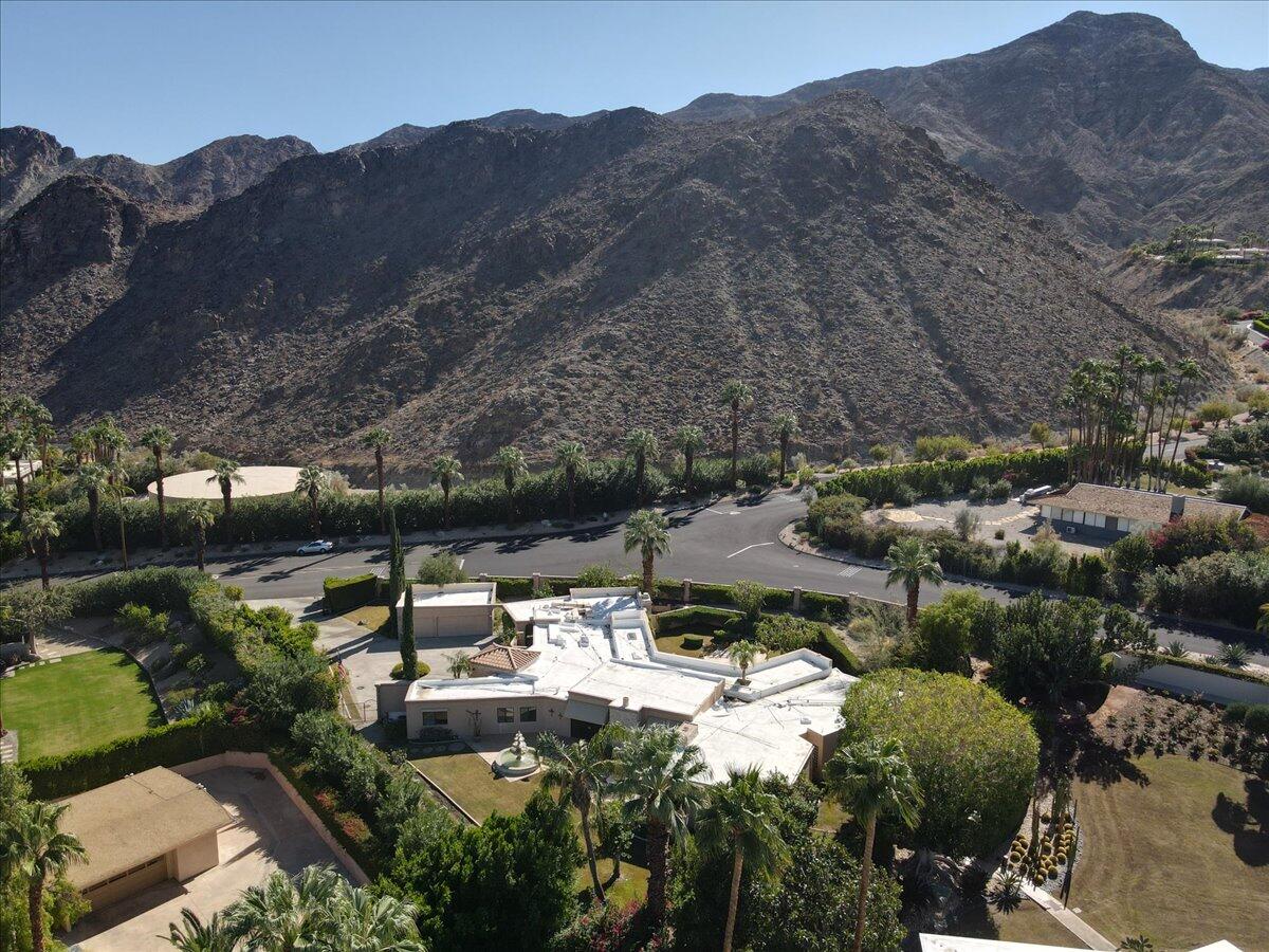 40885 Thunderbird Road Rancho Mirage, CA 92270 - Photo 59 of 61 a view of a lush green hillside and houses