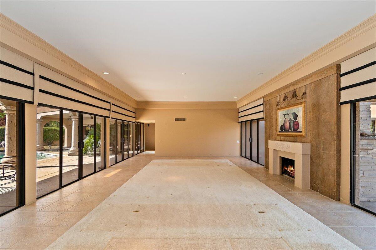40885 Thunderbird Road Rancho Mirage, CA 92270 - Photo 8 of 61 a view of a livingroom with an empty space and a fireplace