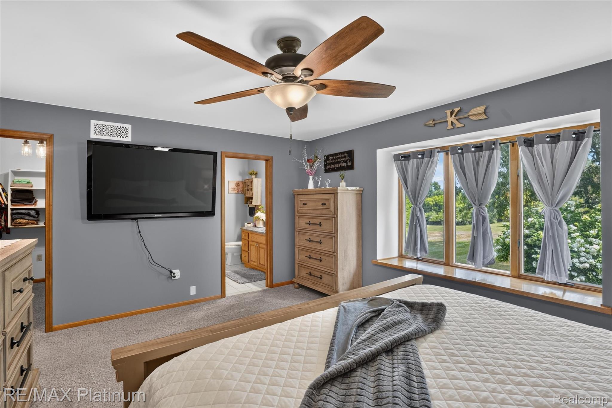 4457 Bradley Road Gregory, MI 48137 - Photo 18 of 79 Bedroom with wood-finish trim and ceiling fan