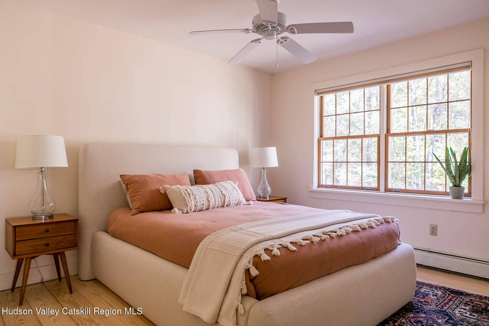 439 Silver Hollow Road Chichester, NY 12416 - Photo 16 of 36 a bedroom with a large bed and a window
