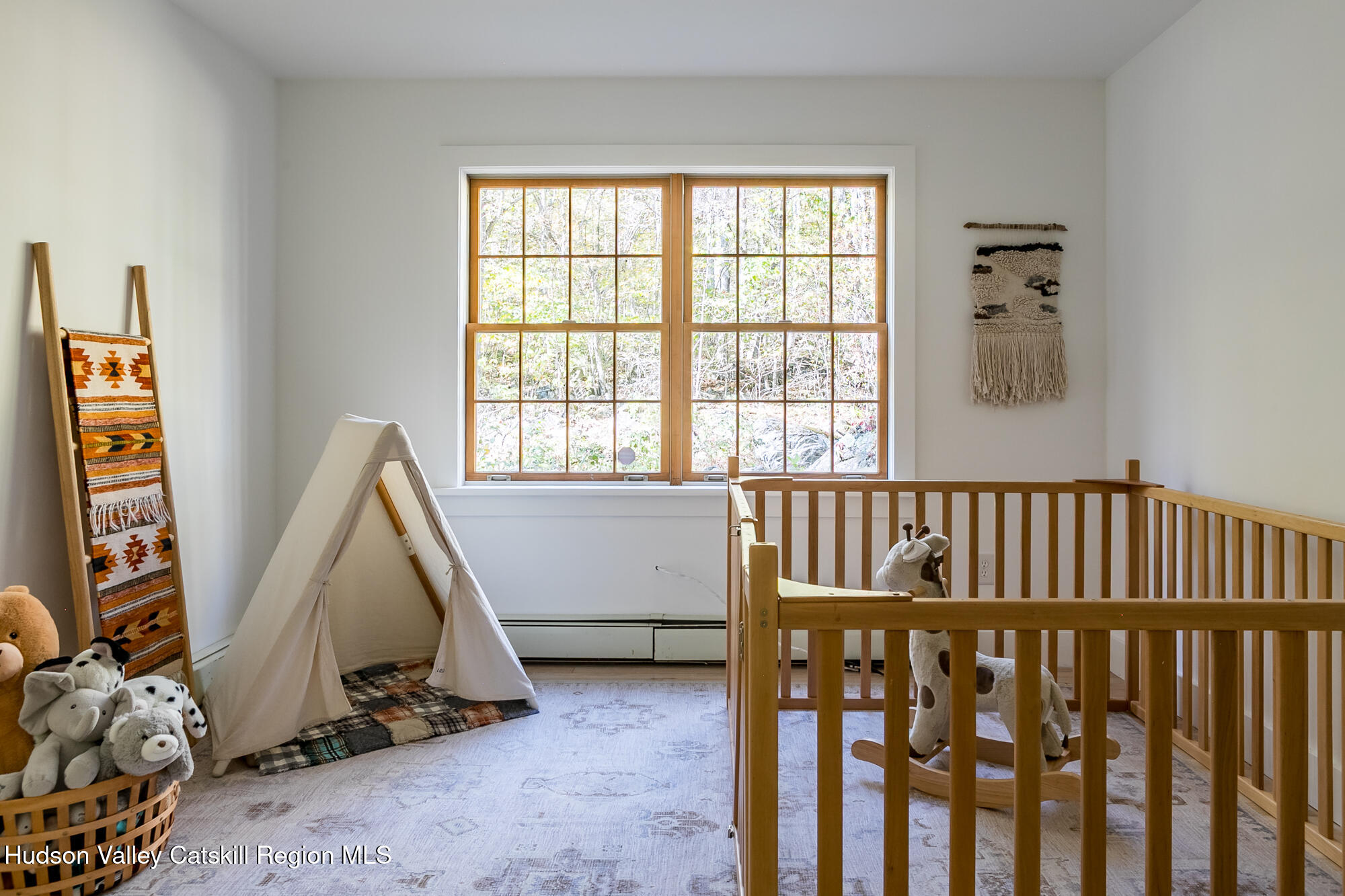 439 Silver Hollow Road Chichester, NY 12416 - Photo 20 of 36 a view of a bedroom with furniture and windows