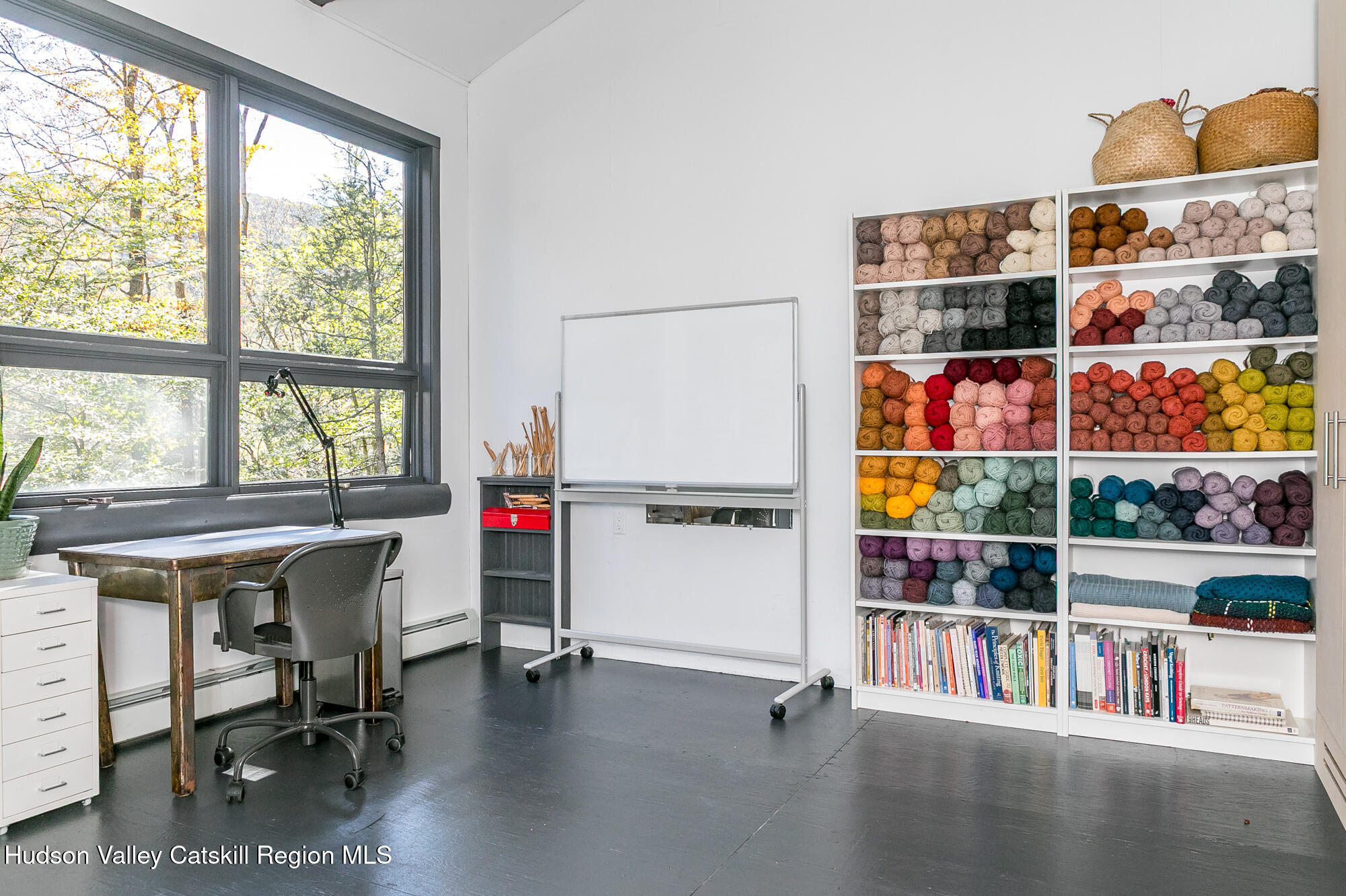439 Silver Hollow Road Chichester, NY 12416 - Photo 21 of 36 a room with furniture and a book shelf