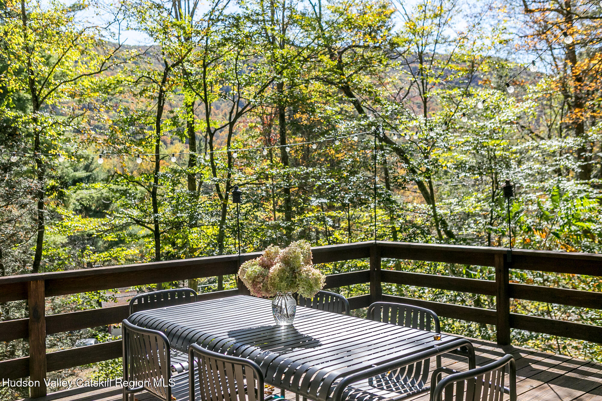439 Silver Hollow Road Chichester, NY 12416 - Photo 24 of 36 a view of a balcony with wooden floor and outdoor seating