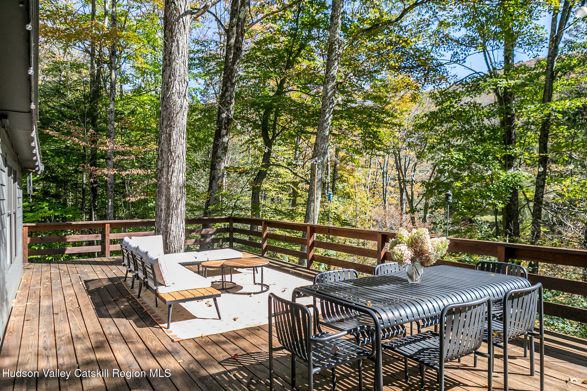 439 Silver Hollow Road Chichester, NY 12416 - Photo 25 of 36 a view of a patio with a table and chairs