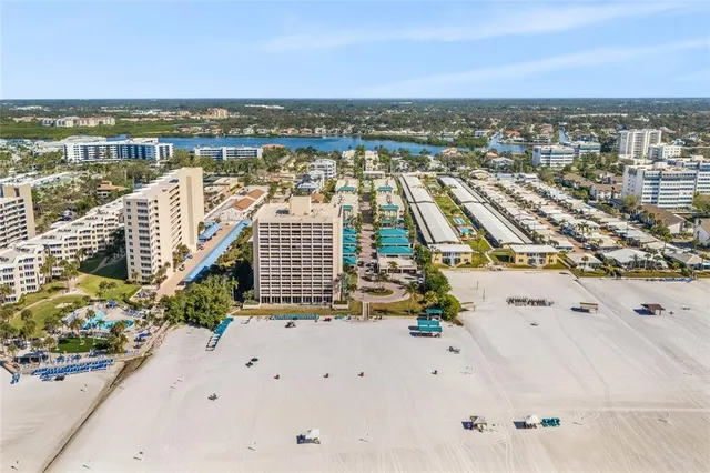 an aerial view of residential building and ocean view