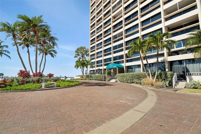 front view of a building with a garden