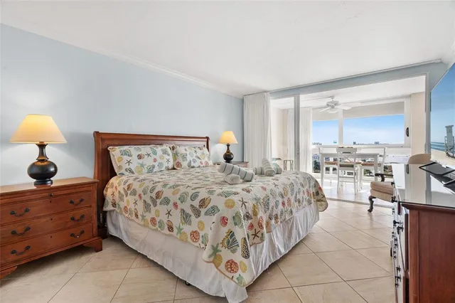 a bedroom with a bed and a night stand