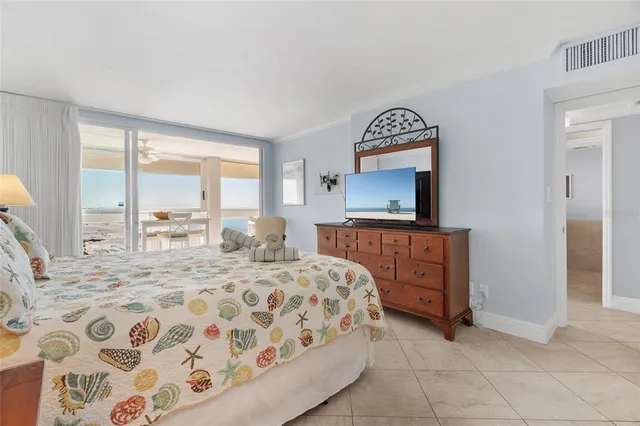 a bedroom with a bed and a dresser in it