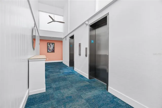 a view of a hallway with bathroom