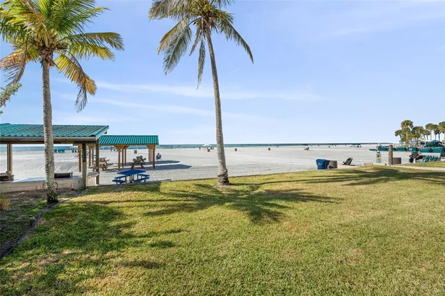 a view of a swimming pool with a table and chairs