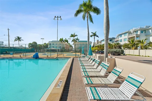 a view of a swimming pool with a lounge chairs