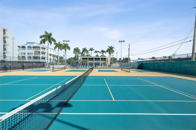 a view of a swimming pool with outdoor space and a lake view