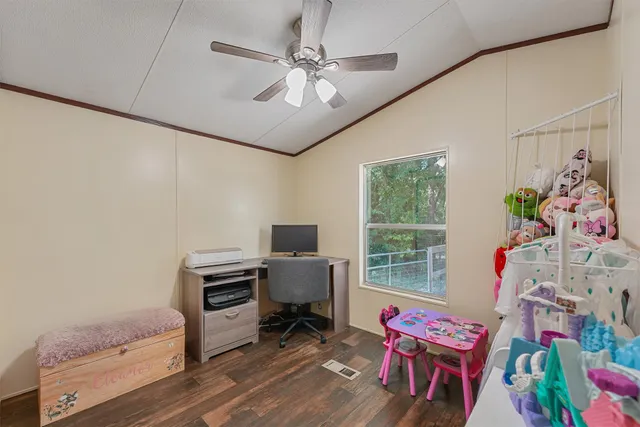 a bathroom with a granite countertop sink a toilet and a mirror