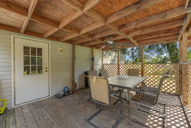 a view of yard with swimming pool and green space