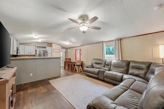 a room with furniture and a flat screen tv