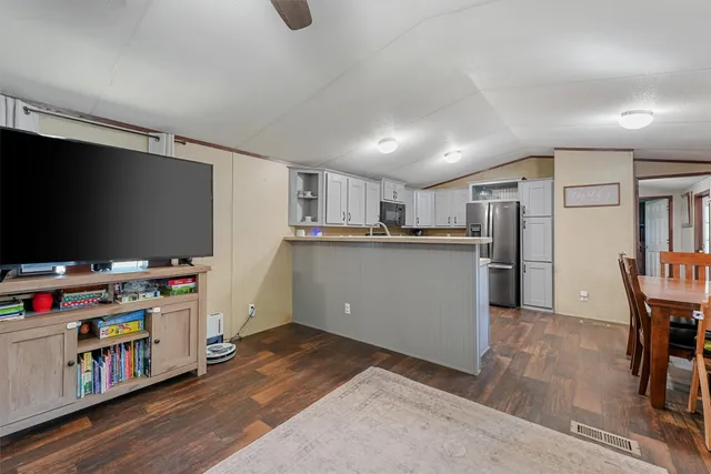 a kitchen with a refrigerator stove and microwave