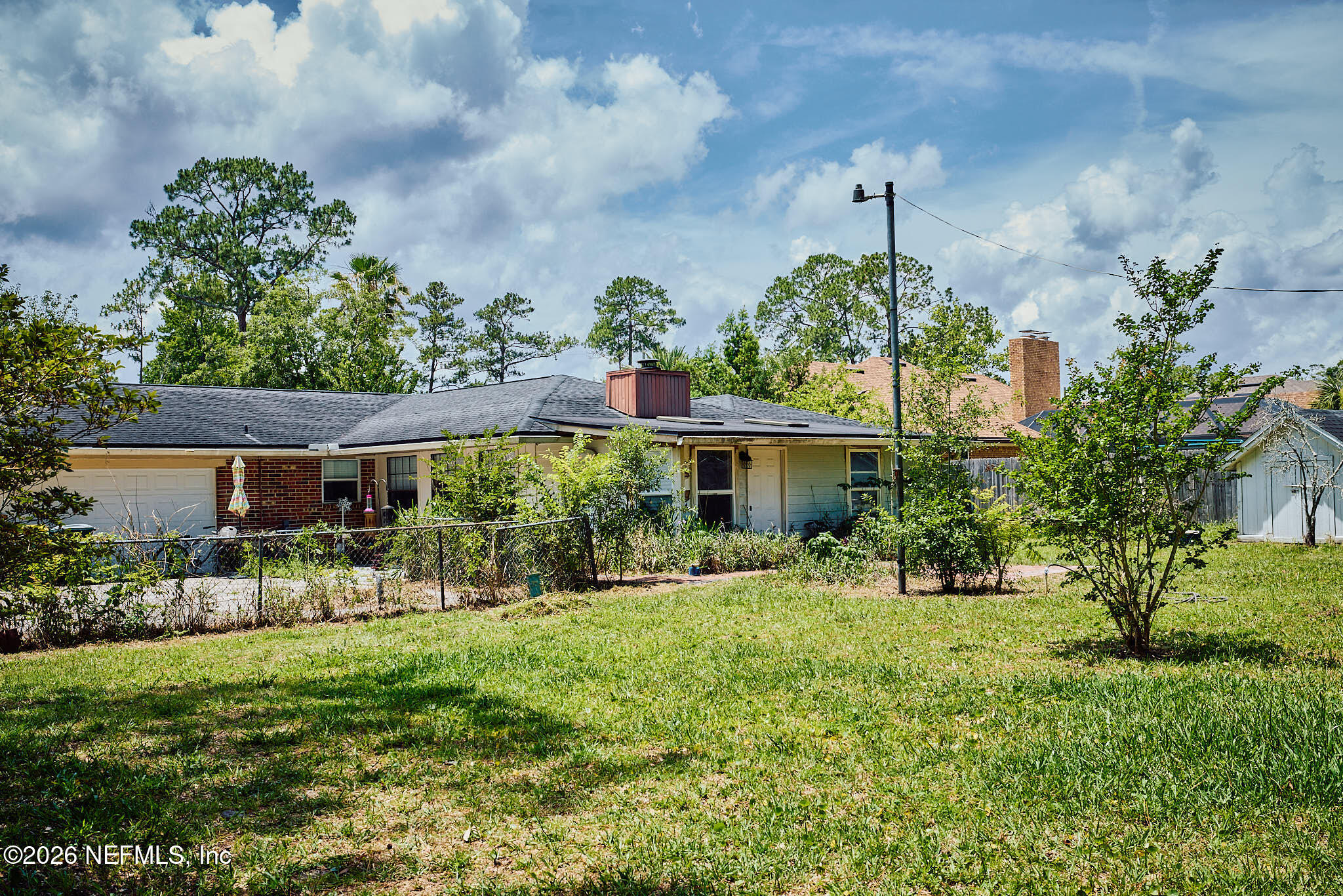 8965 San Rae Road Jacksonville, FL 32257 - Photo 41 of 46 a front view of a house with a yard