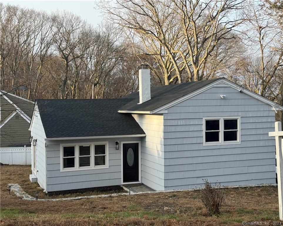 22 Leffert Road Trumbull, CT 06611 - Photo 1 of 1 a front view of a house with a yard