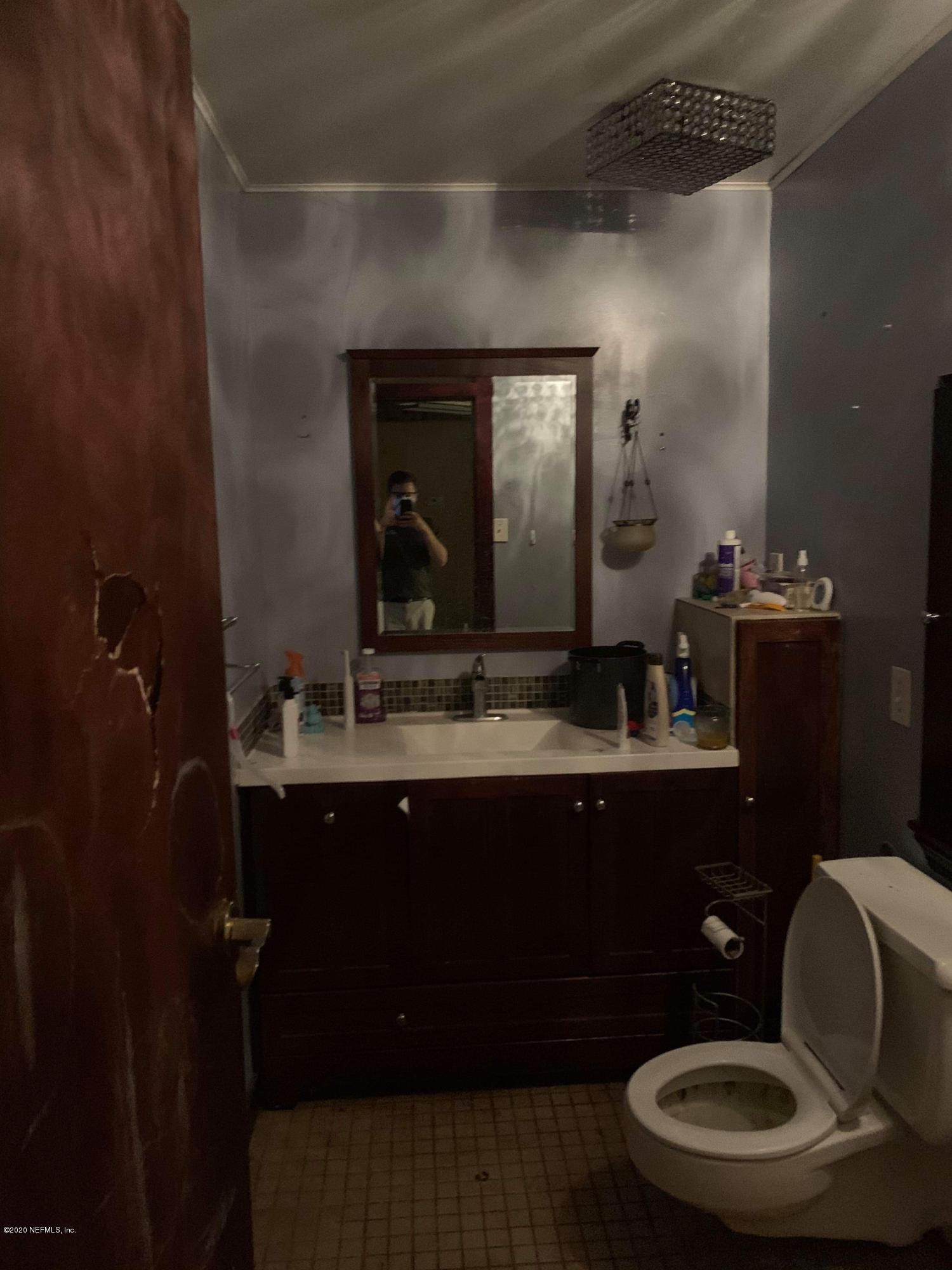 2385 Pellicer Road St. Augustine, FL 32092 - Photo 26 of 38 a bathroom with a sink and a mirror