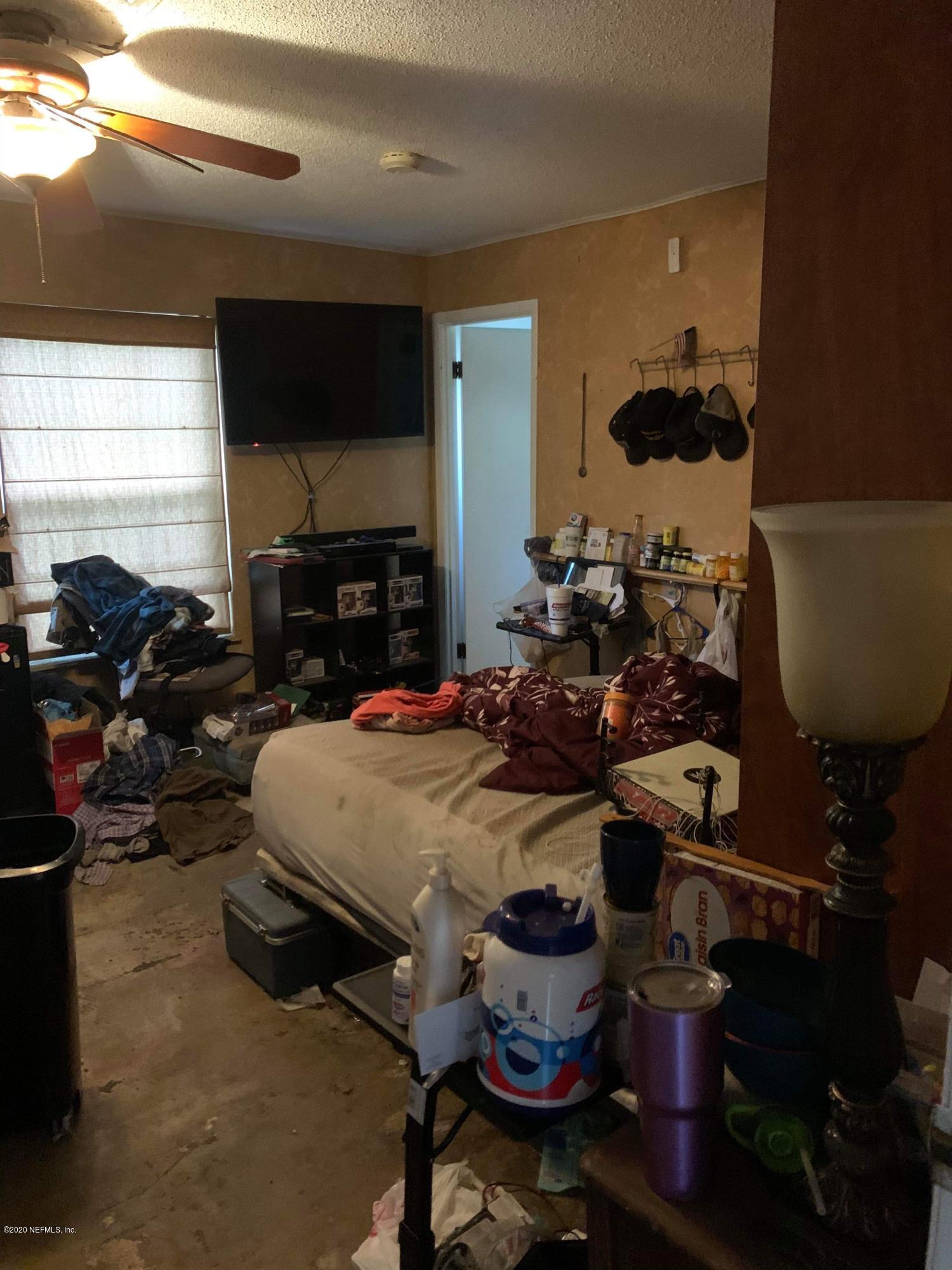 2385 Pellicer Road St. Augustine, FL 32092 - Photo 32 of 38 a room with lots of furniture and a wooden floor