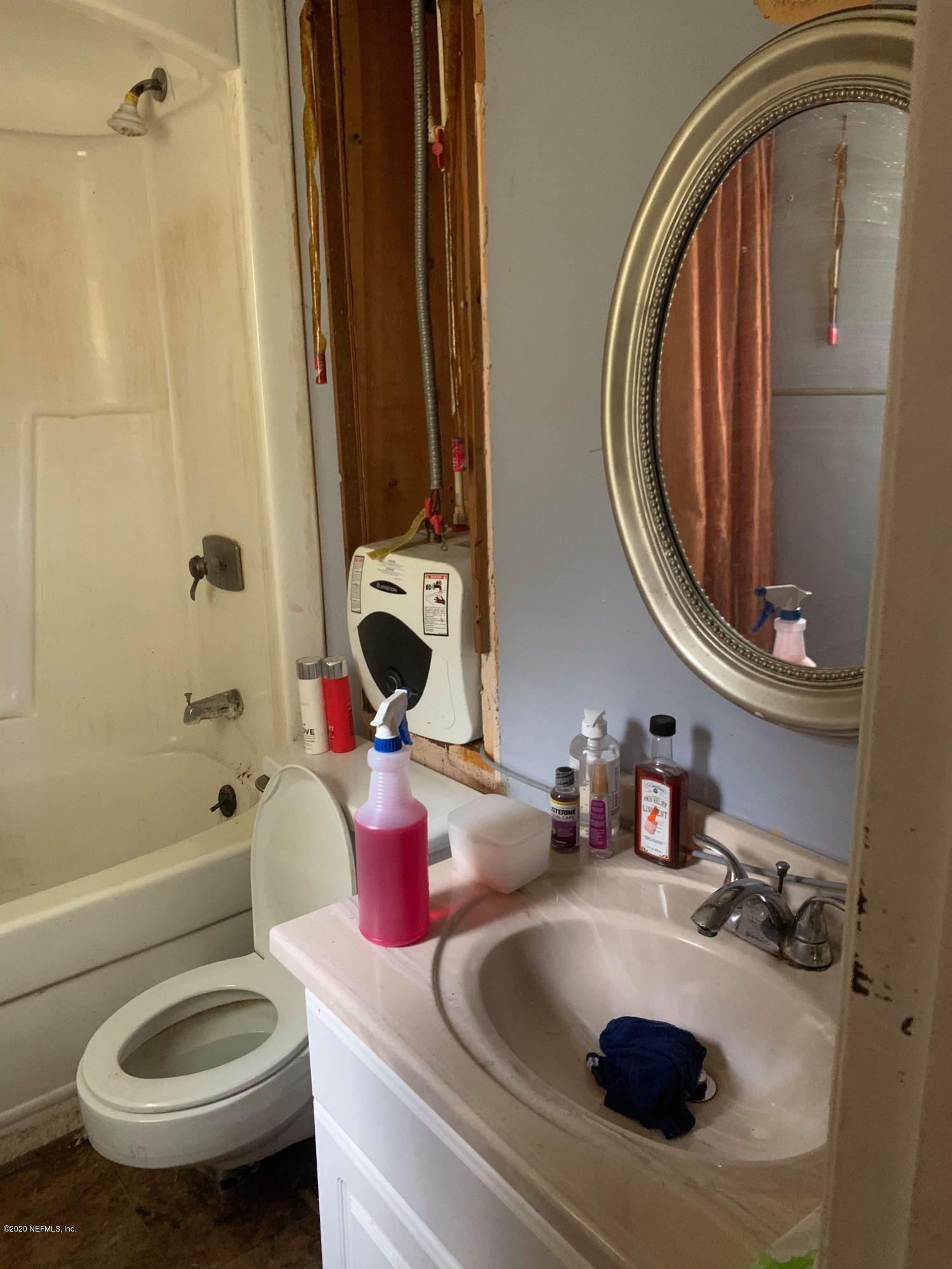 2385 Pellicer Road St. Augustine, FL 32092 - Photo 9 of 38 a bathroom with a sink and a mirror