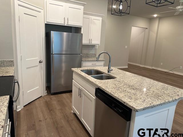 16461 County Road 178, Unit 4 Tyler, TX 75703 - Photo 4 of 16 a kitchen with stainless steel appliances granite countertop a sink stove and refrigerator