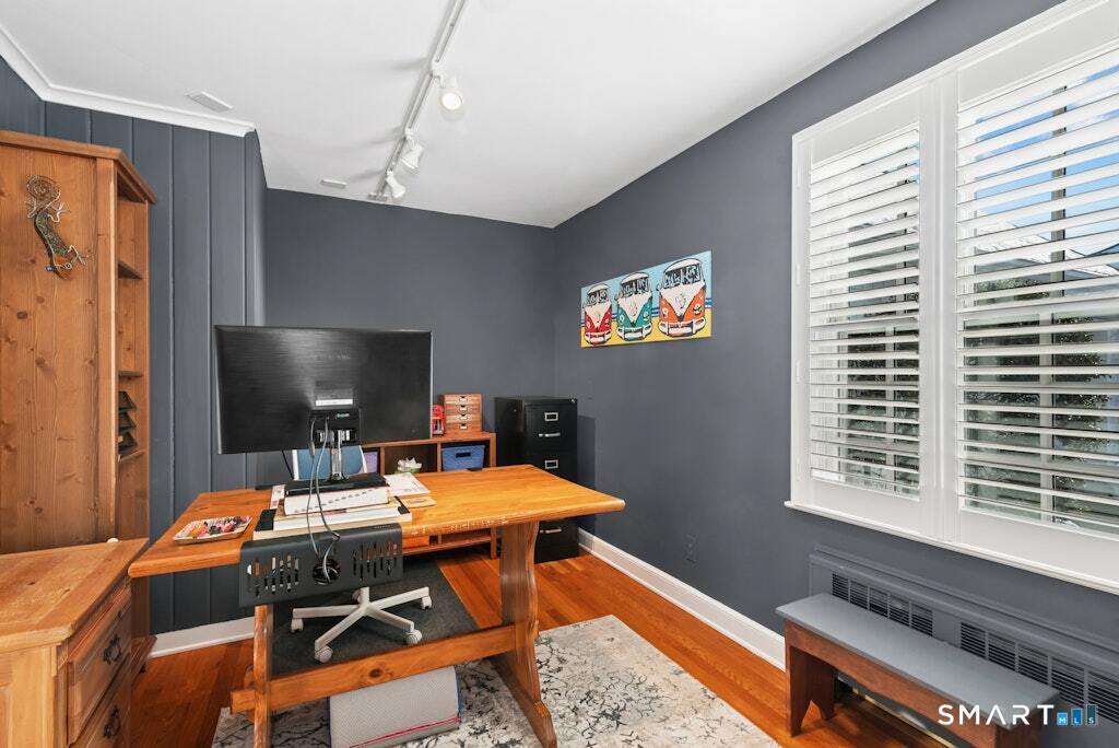 30 Windy Ridge Place Trumbull, CT 06611 - Photo 15 of 39 Hardwood flooring and track lighting.