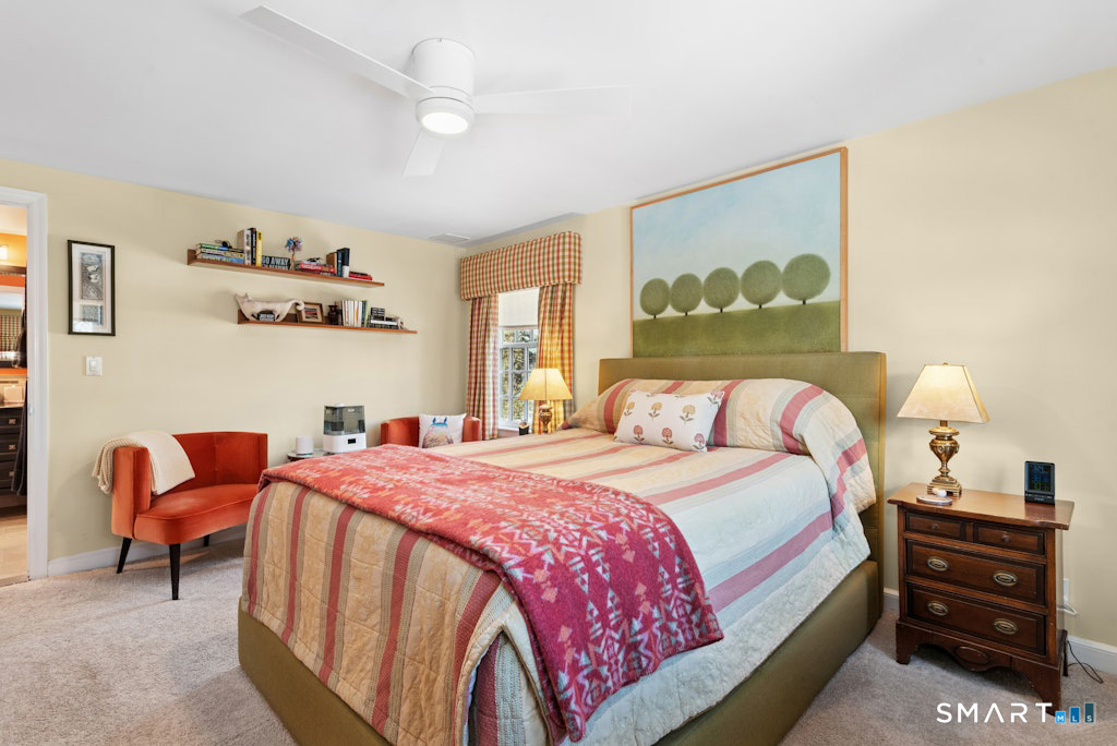 30 Windy Ridge Place Trumbull, CT 06611 - Photo 17 of 39 Primary with carpet (hardwood underneath), custom walk-in closet with bamboo flooring and full spa bath with radiant heat flooring.