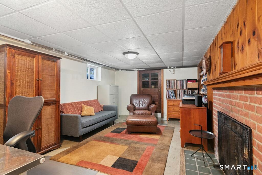 30 Windy Ridge Place Trumbull, CT 06611 - Photo 26 of 39 Lower level office or playroom with fireplace.