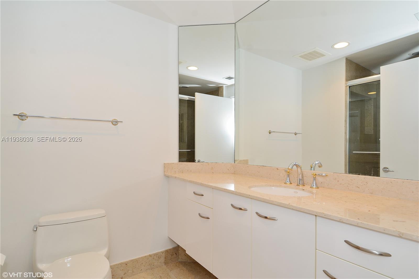 21200 Point Place, Unit 404 Aventura, FL 33180 - Photo 14 of 22 a bathroom with a sink and a mirror
