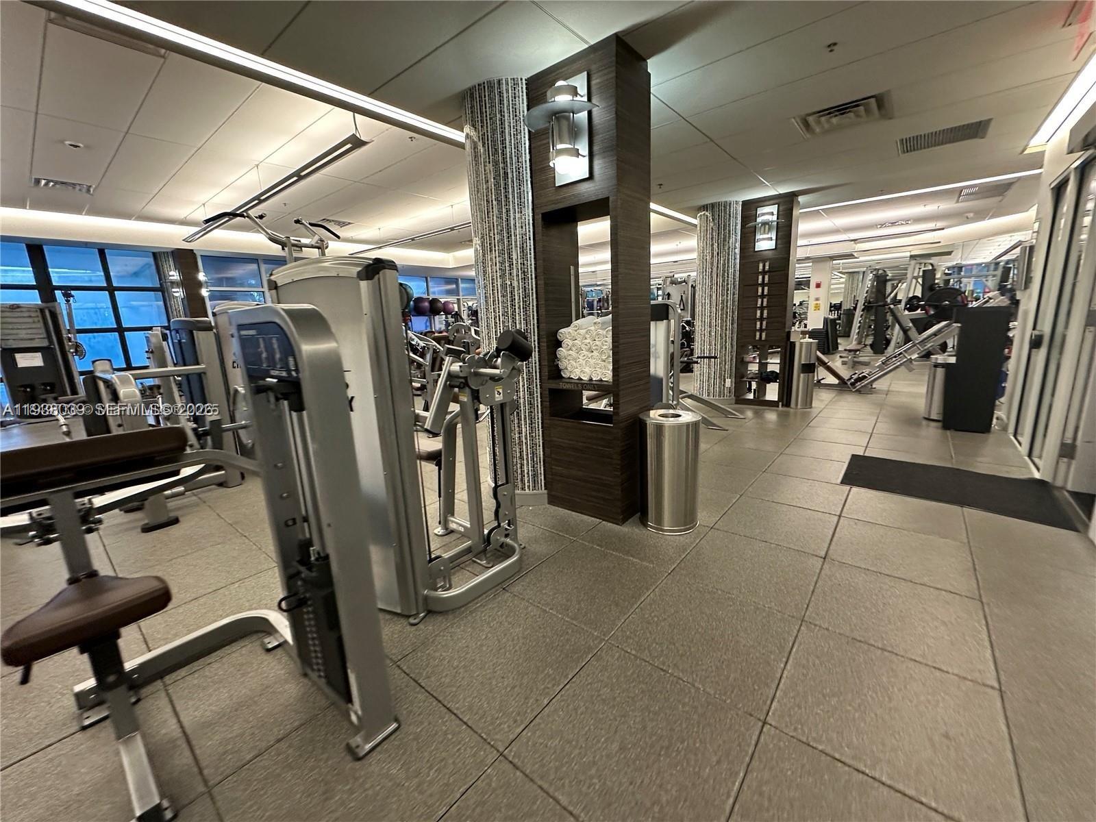 21200 Point Place, Unit 404 Aventura, FL 33180 - Photo 18 of 22 a view of a room with gym equipment