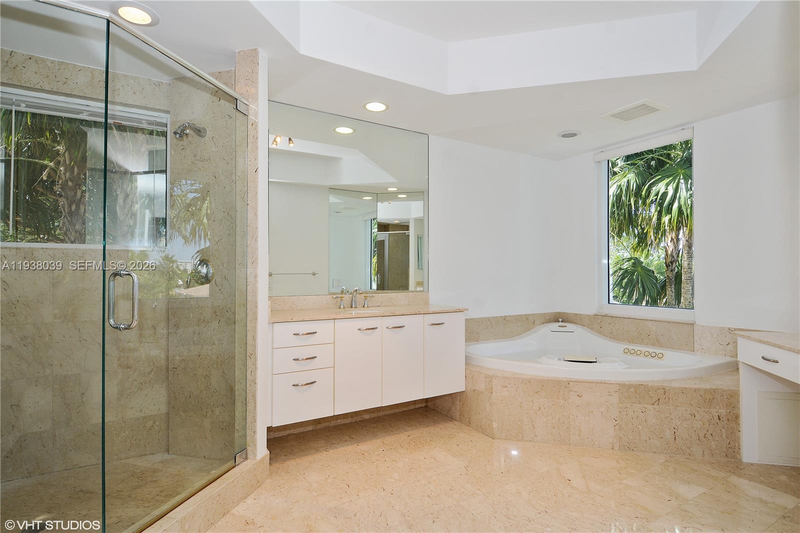 21200 Point Place, Unit 404 Aventura, FL 33180 - Photo 9 of 22 a bathroom with a bathtub shower and sink